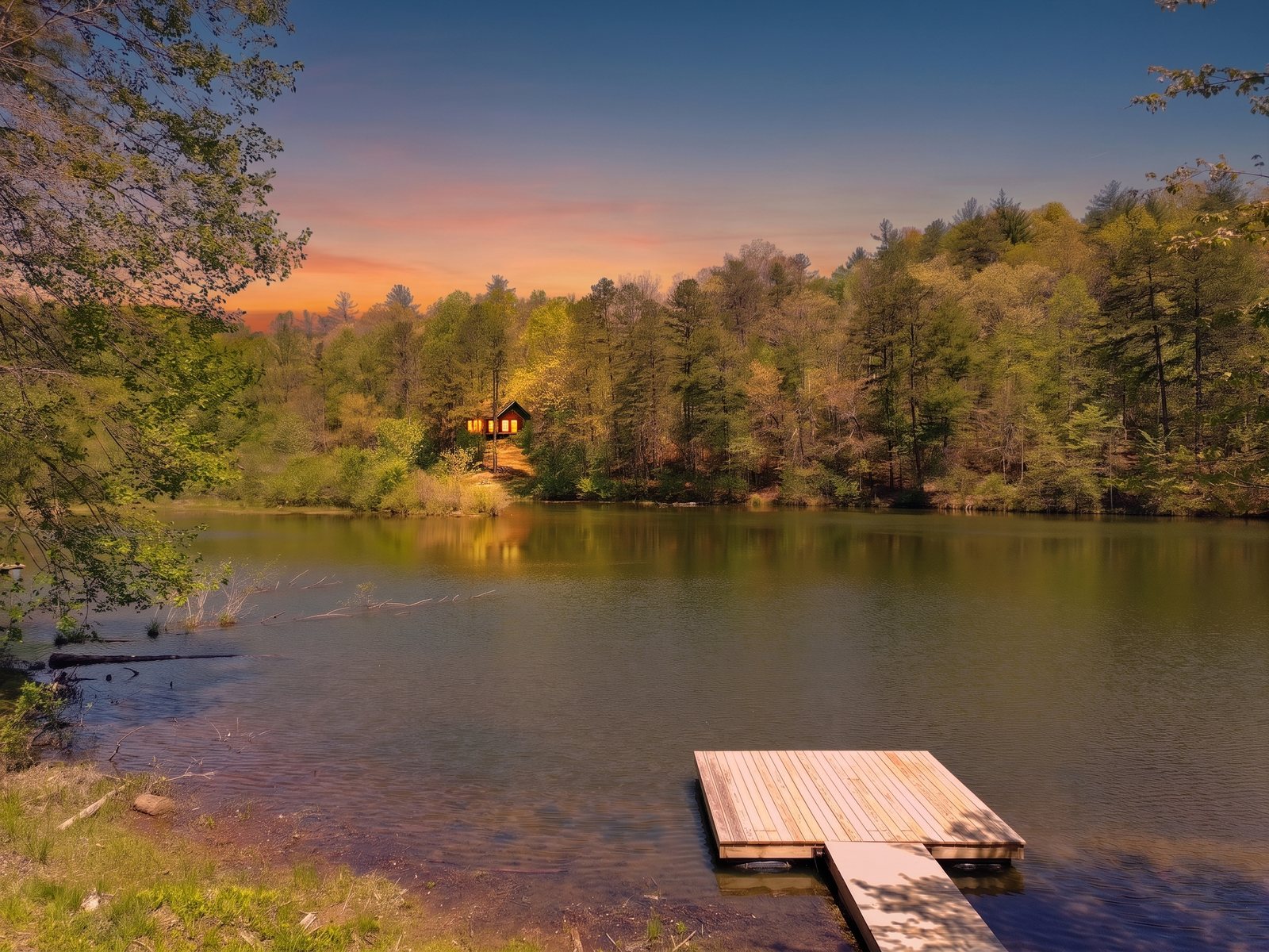 Private lake and dock at sunset