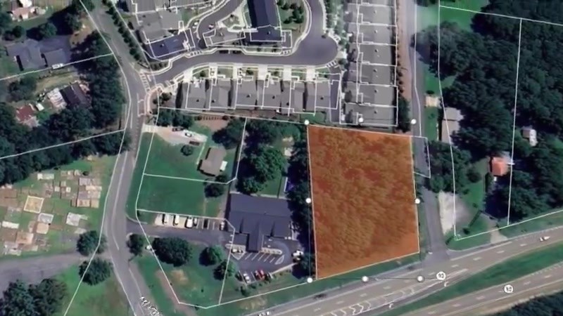 Aerial view of the vacant one-acre lot on Highway 92, outlined
